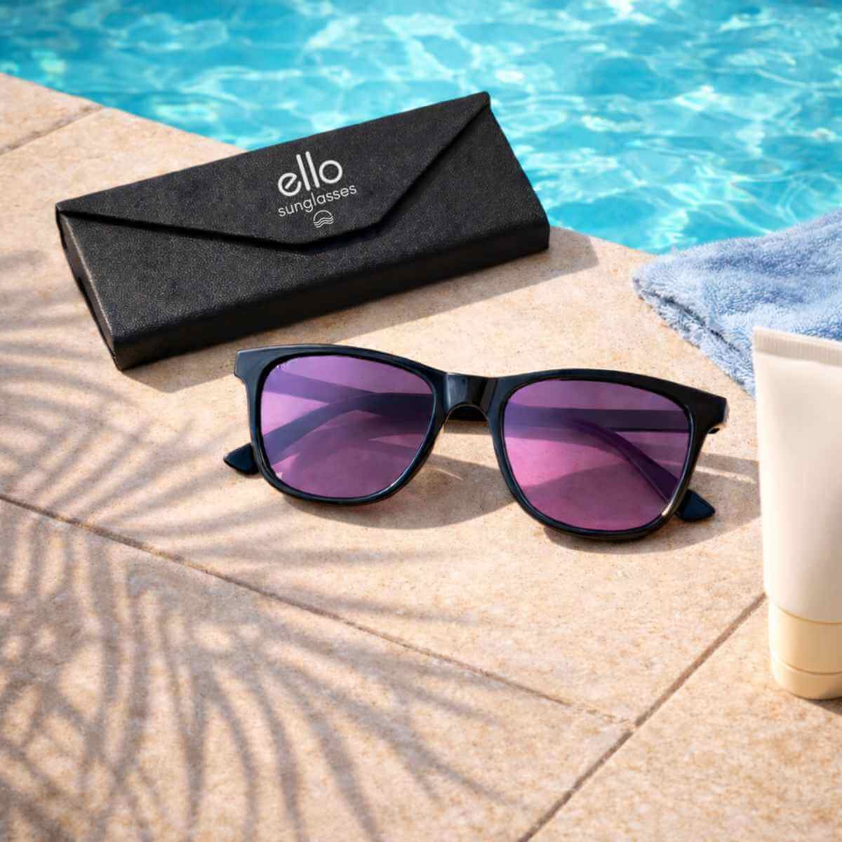 Lightweight sunglasses for petite faces and small heads styled poolside with palm tree shadow and ello case