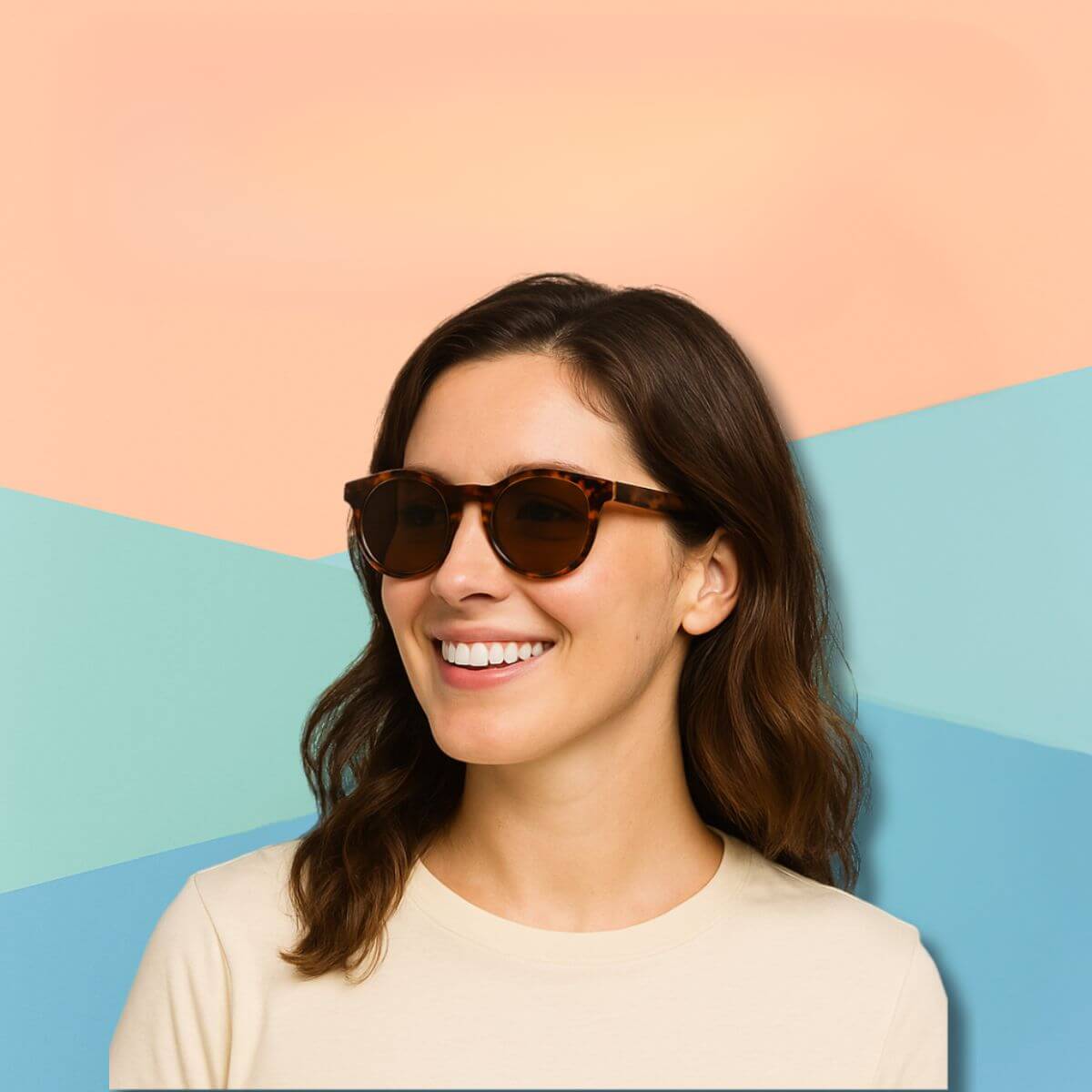 A smiling woman wearing tortoiseshell round sunglasses with the title 'The Best Frame Shapes for Petite Features: A Sunglasses Style Guide' displayed on a peach, orange, and green background.