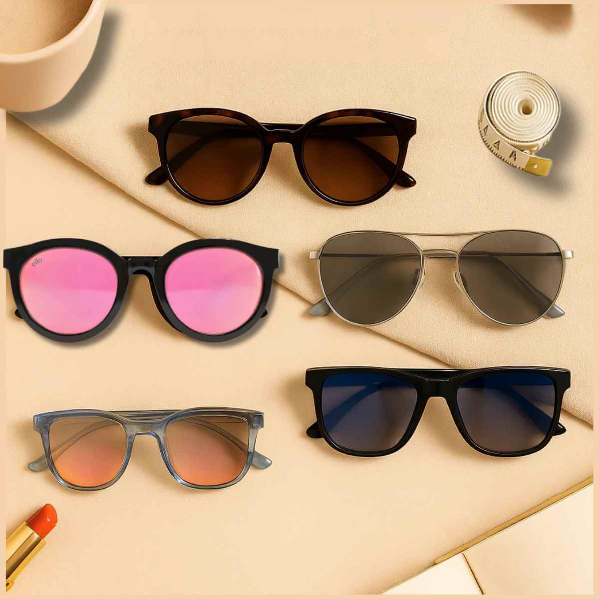 Flat lay of petite sunglasses in different shapes for small faces and narrow heads on a tan background