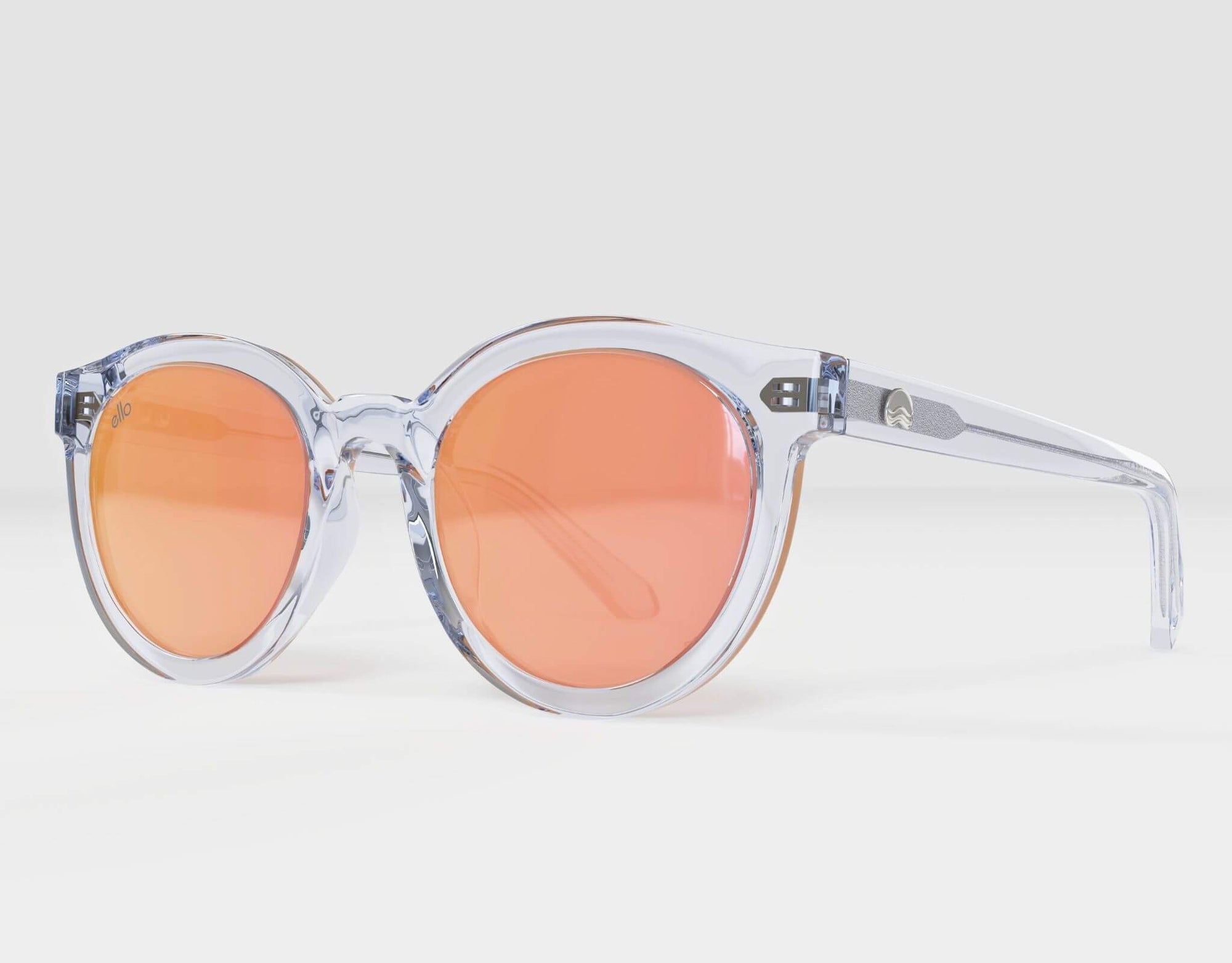Side view of Bar Harbor clear frame sunglasses with peach mirror lenses for small faces.