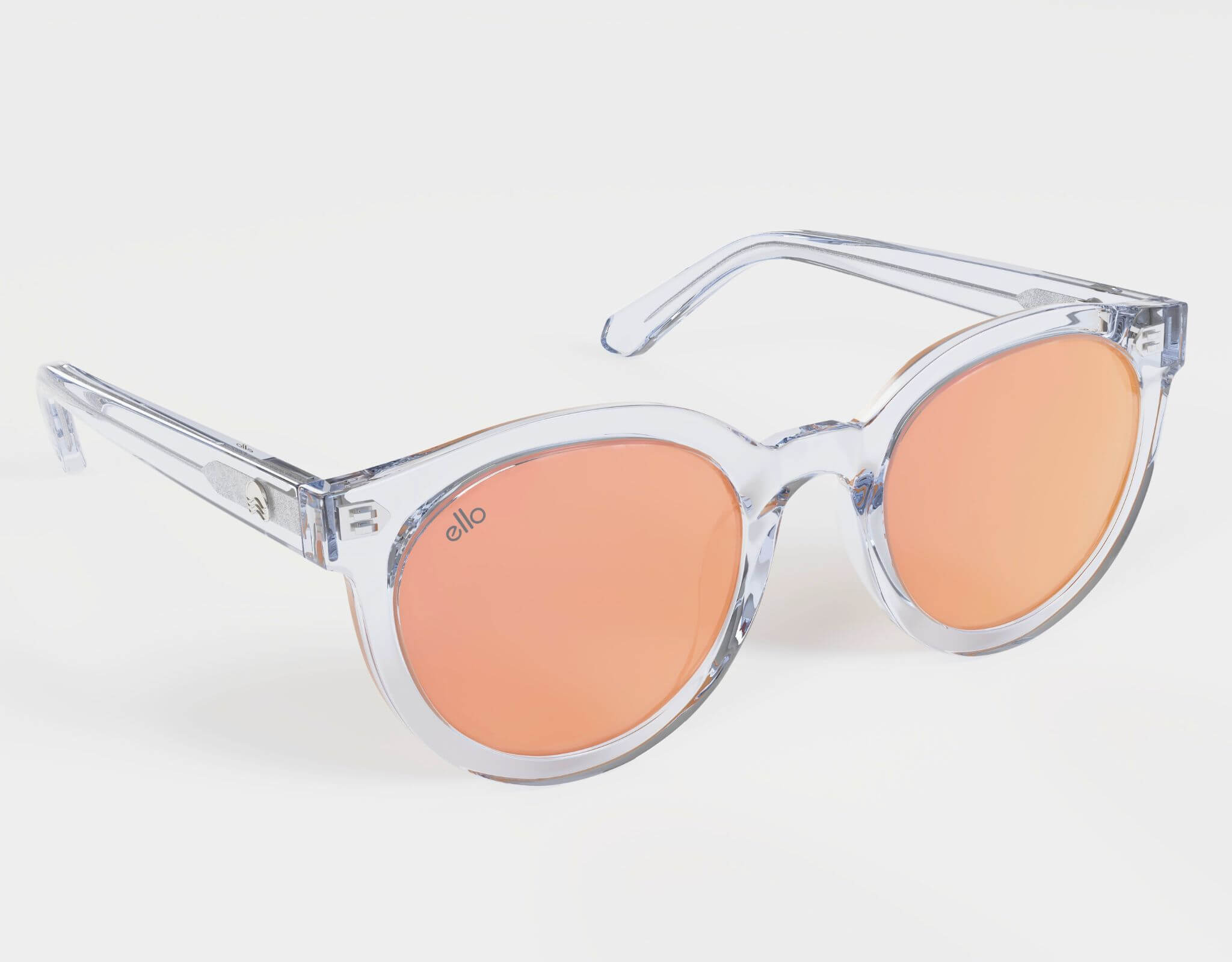 High angle view of clear and peach Bar Harbor sunglasses tailored for smaller faces.