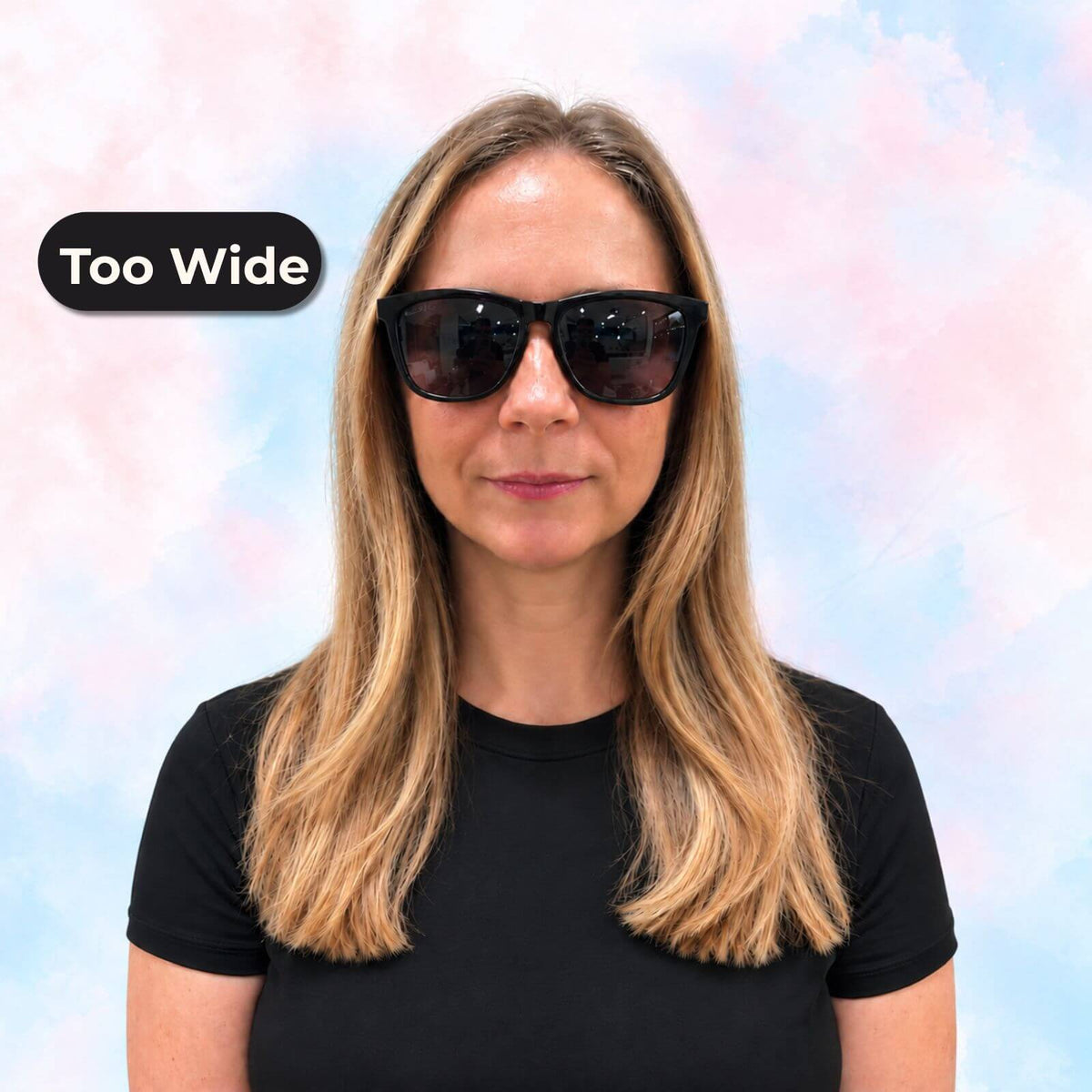 Woman wearing oversized black sunglasses that appear too wide for her face, shown before switching to petite-fit sunglasses.