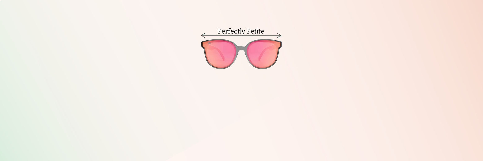 Wide view of pink lens petite sunglasses with “Perfectly Petite” width label, centered on a soft gradient background—ideal sunglasses for petite faces.