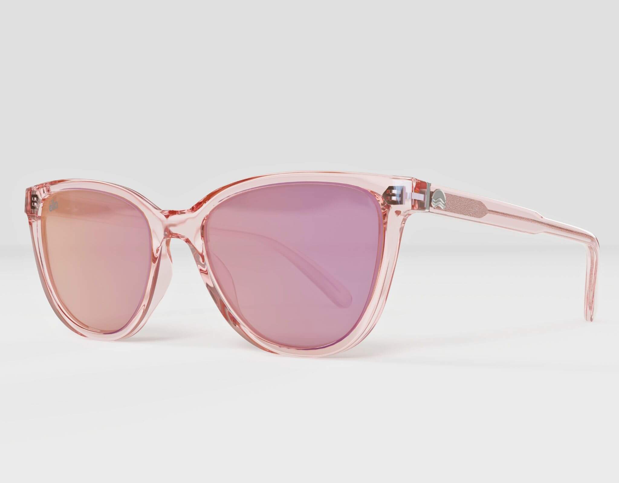 Side profile of pink Half Moon Bay cat eye frame with vibrant purple lenses, built for small faces.