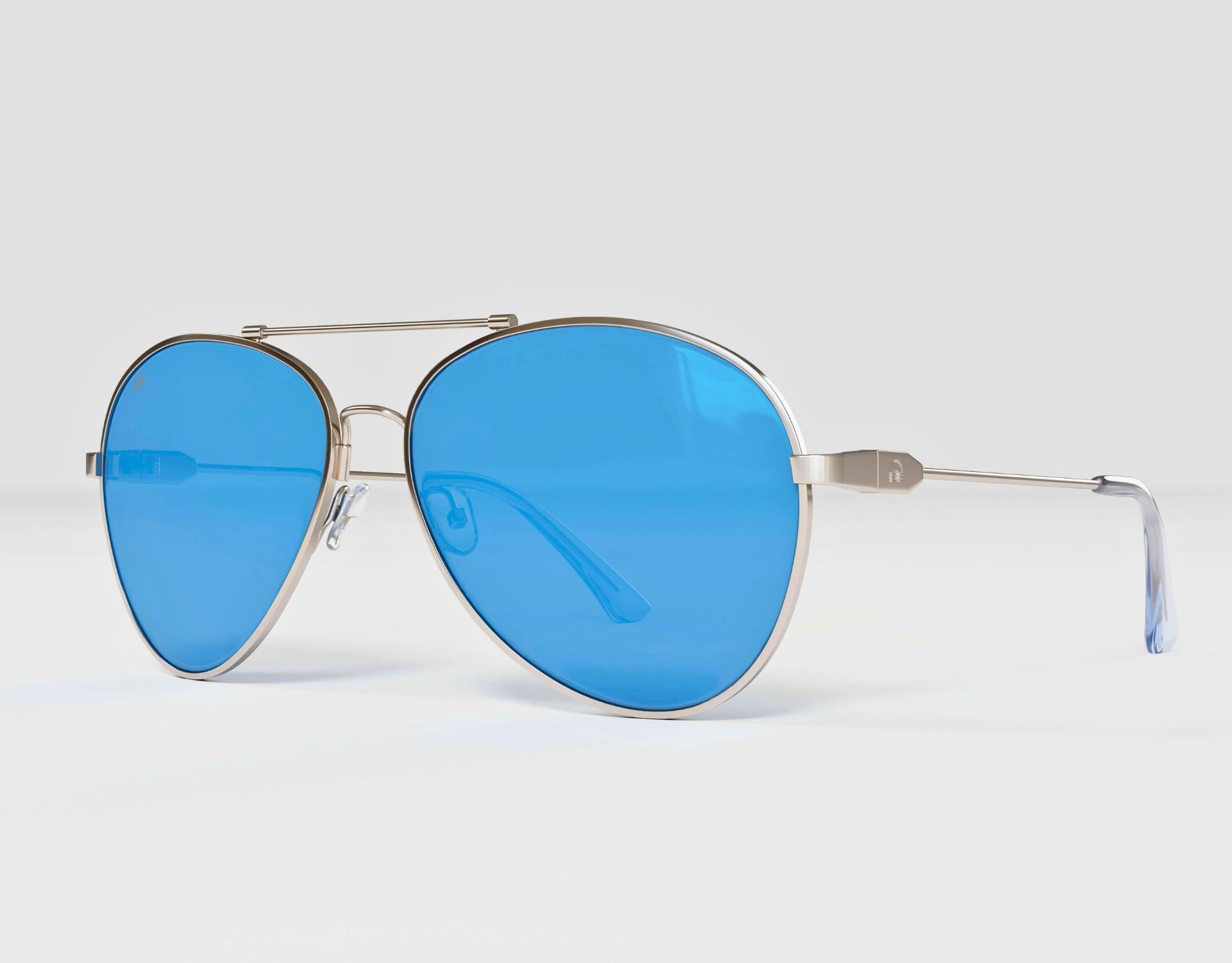 Side view of Bali aviator sunglasses featuring a silver frame and blue lenses for small face.