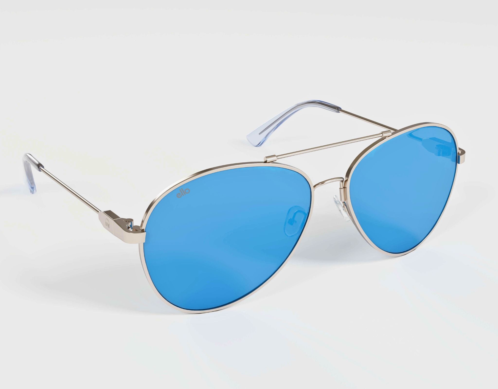 High angle view of Bali aviator sunglasses in silver with blue lenses, perfect for small face shapes.