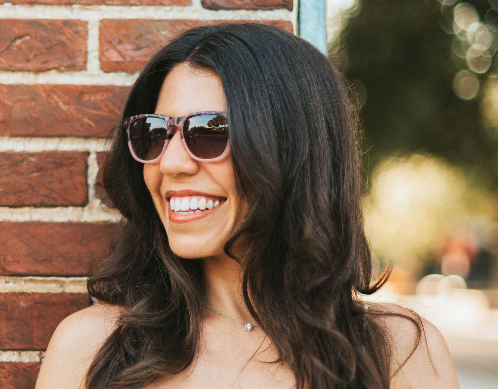 Real-world fit of Outer Banks sunglasses for petite faces and small heads, featuring lightweight frames and everyday outdoor wear