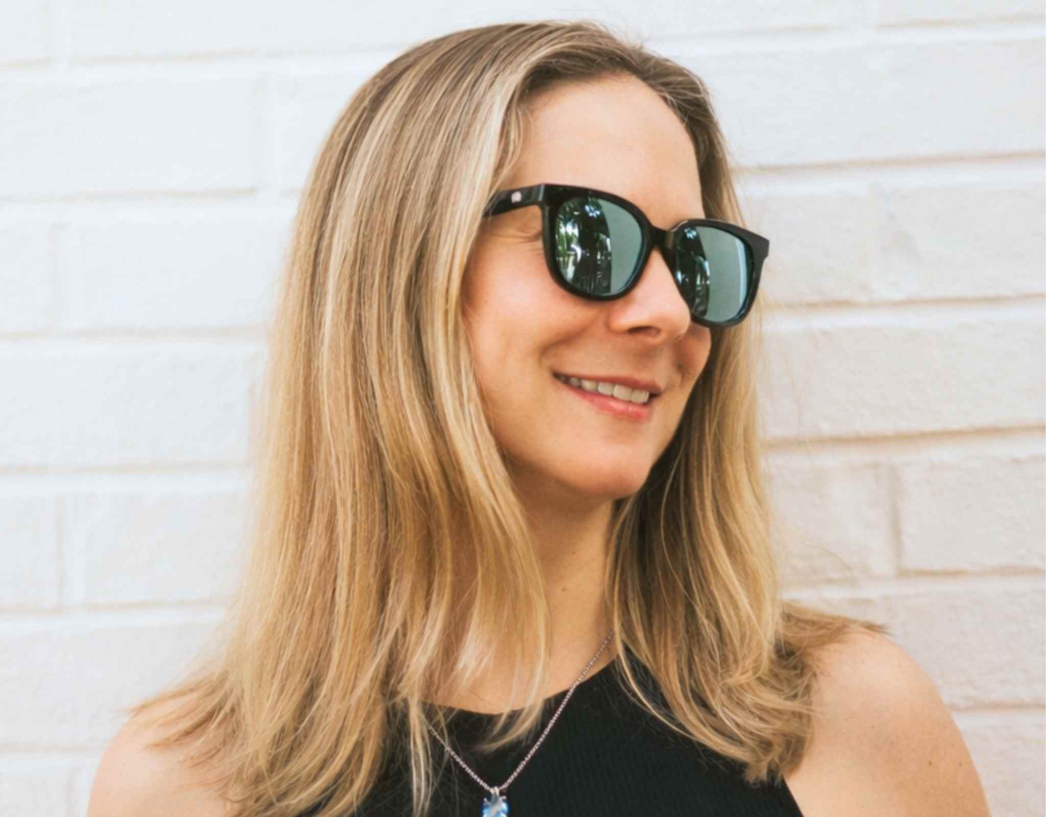 Model wearing Pebble Beach sunglasses for petite faces, lightweight small head sunglasses designed for everyday comfort and sun protection