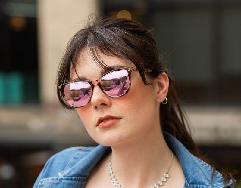 Tortoise pink Half Moon Bay cat eye sunglasses for smaller faces shown on a woman in a lifestyle setting